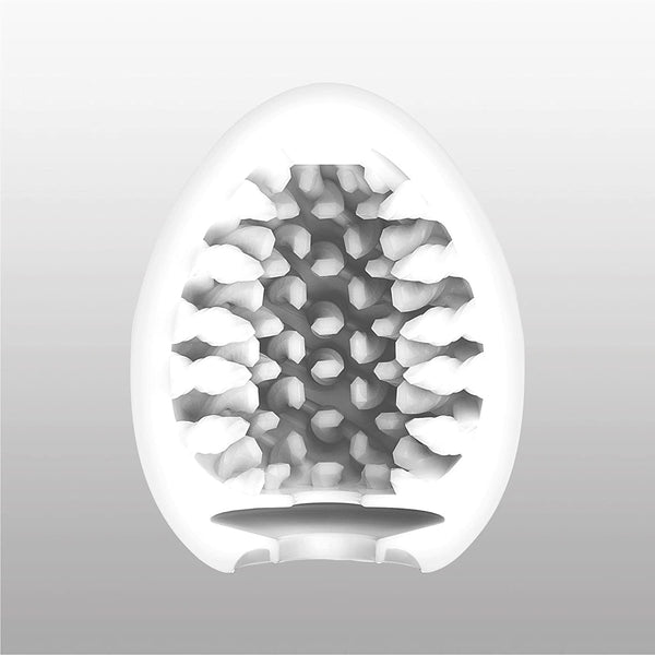 TENGA EGG BRUSH 的蛋型剖面示意圖，內部長突起刷毛結構帶來細膩且連續的刺激體驗。