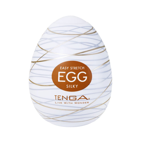 TENGA EGG SILKY 飛機蛋外觀包裝正面圖，白色蛋形搭配金色絲線設計，展現典雅風格