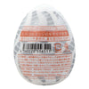 TENGA EGG TORNADO 飛機蛋 背面圖，顯示產品條碼與使用說明，標示螺旋邊緣設計與高彈性材質特點。