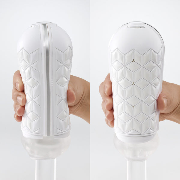 TENGA FLIP ZERO GRAVITY 白色款飛機杯手持實拍，展示外殼立體幾何紋理與實際握感對比